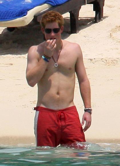 Prince Harry shirtless with his girlfriend Chelsy Davy on the beach