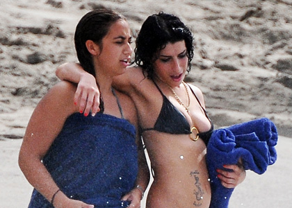 Amy Winehouse Hits the Beach, Loses Her Top