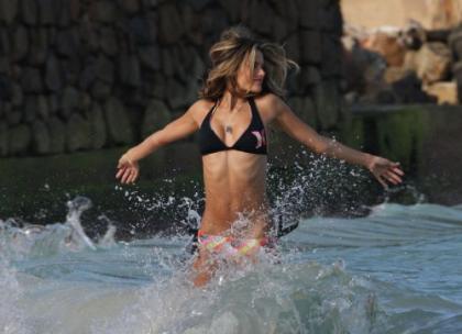 Alessandra Ambrosio is doing a bikini photo shoot
