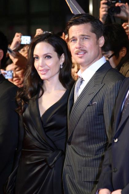 Angelina Jolie says she's happy & fulfilled, she & Brad 'collapse' on sofa