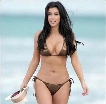 Kim Kardashian Throws Football in a Bikini