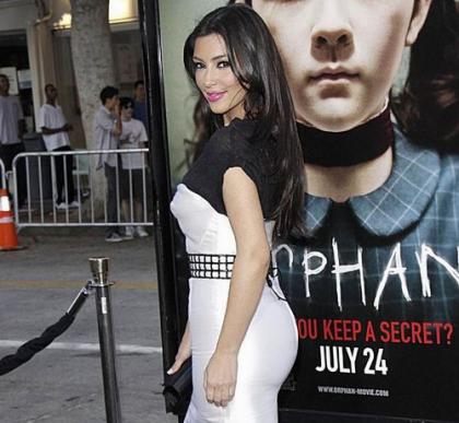 Kim Kardashian Takes in Orphan