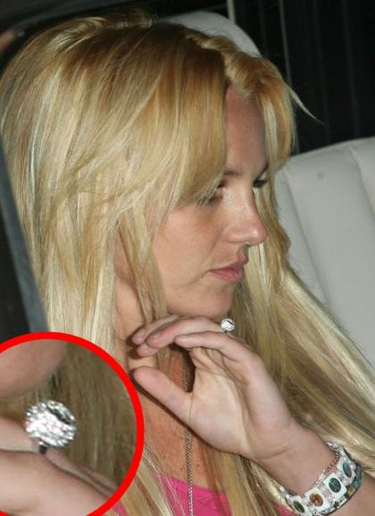 Britney Spears goes back to braless  blonde, flashes a diamond ring