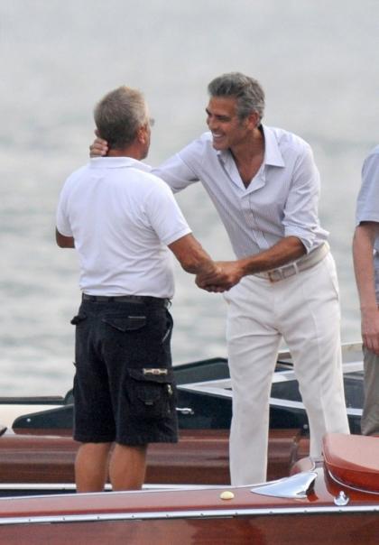 George Clooney broke his hand, probably doing some crazy sex thing