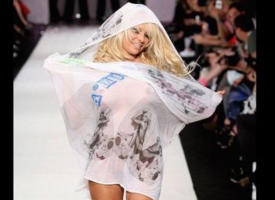 Pamela Anderson wears just a scarf