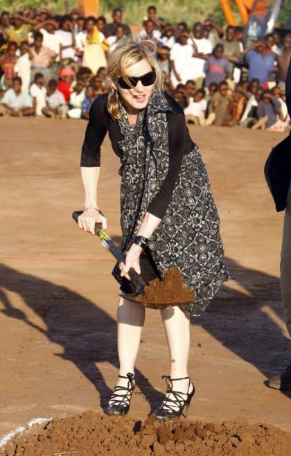 Madonna, clad in stilettos, plants a tree in Malawi