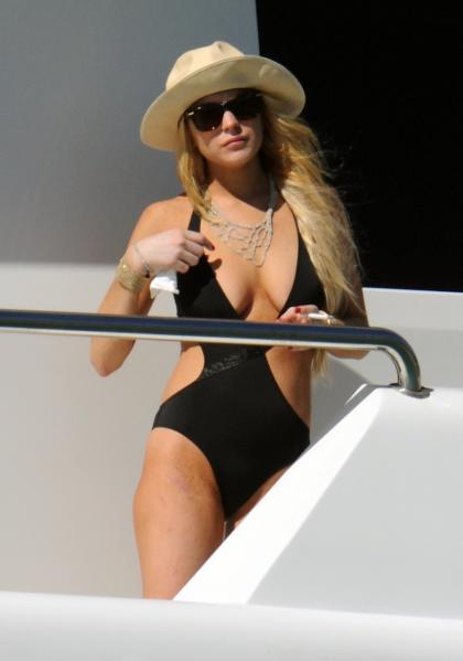 Lindsay Lohan shows off her bruises  her breasts in St. Barth