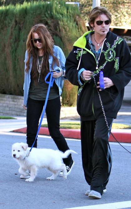 Miley and Billy Ray Cyrus: Out with the Pups