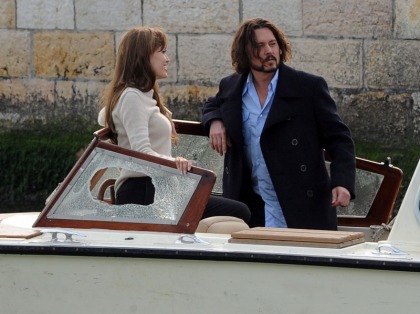 Angelina Jolie wears a great sweater, flirts with Johnny Depp