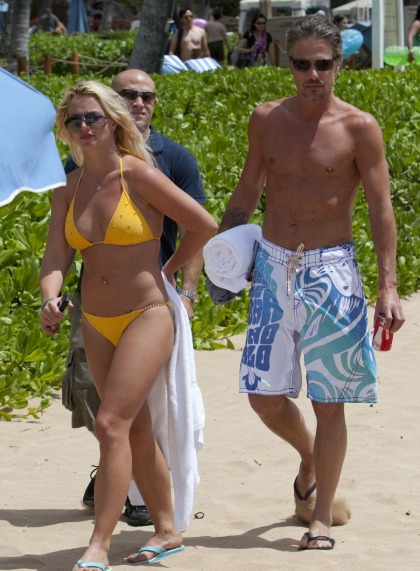 Britney Spears rocks a yellow bikini  a sandy budget weave
