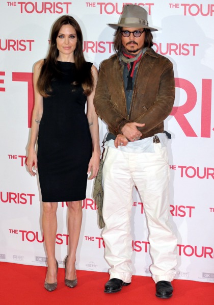 Angelina Jolie & Johnny Depp stand next to each other for a German photo call