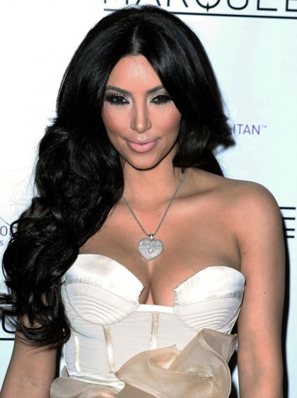 Kim Kardashian's kat-face looks completely normal, by the way