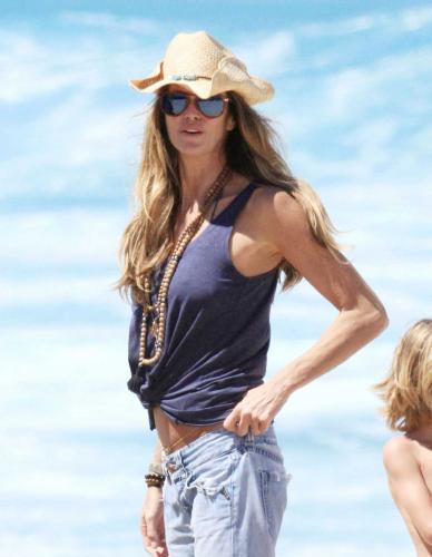 Elle Macpherson's Old Breasts Hit The Beach