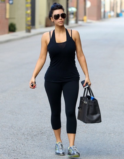Kim Kardashian: 'size 4' in spandex, with an Hermes Birkin gym bag
