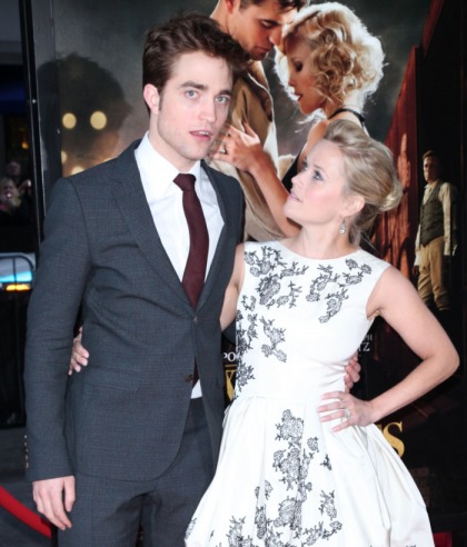 Reese Witherspoon hustles to keep up with Robert Pattinson's fan-friendly moves