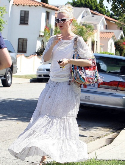 January Jones shows off her small bump, still no clue as to the baby-daddy