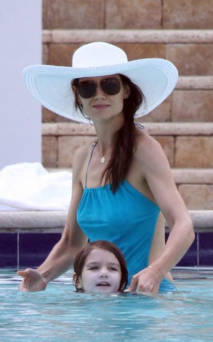 Katie Holmes Lotions Up Her Disgruntled Daughter