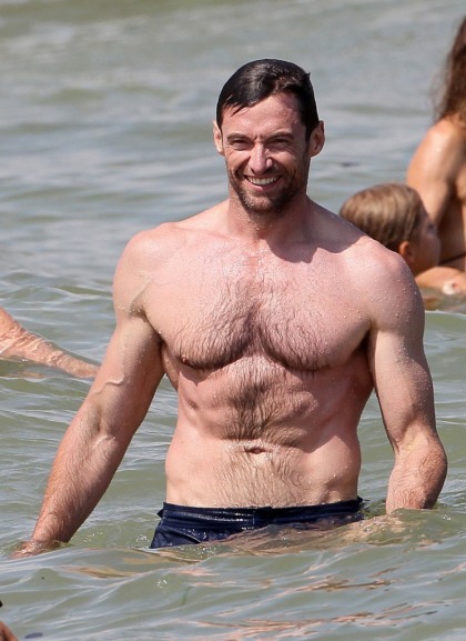Shirtless Hugh Jackman hits the beach