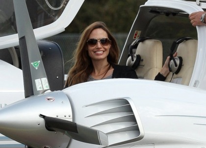 Angelina Jolie takes Maddox flying in England: why is she not stateside?