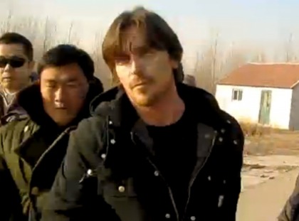 Christian Bale Gets Pushed Around by Chinese Guards