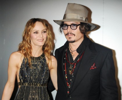 Johnny Depp is having a 'mini midlife crisis' and Vanessa Paradis is tired of it
