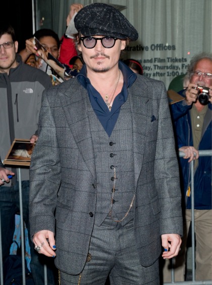 Johnny Depp's mid-life crisis blossoms as he surrounds himself with women