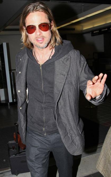 Brad Pitt's Paparazzi Flooded LAX Landing