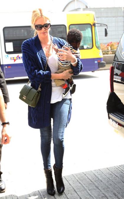 Charlize Theron Catches a Flight with Son Jackson
