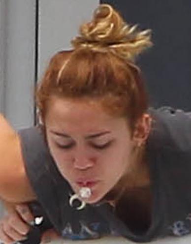 Miley Cyrus Spits, Doesn't Swallow
