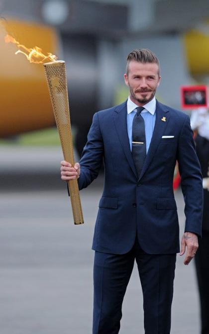 David Beckham Carries the Olympic Flame