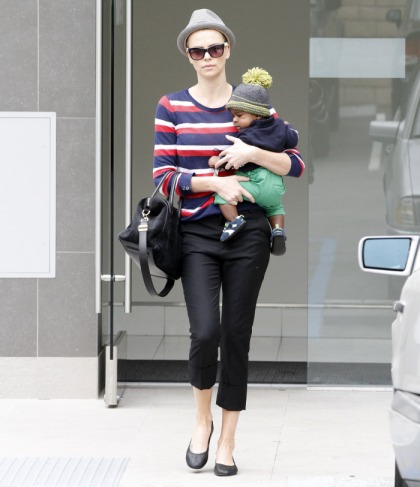 Charlize Theron shows off her newly buzzed hair during an outing with baby Jackson