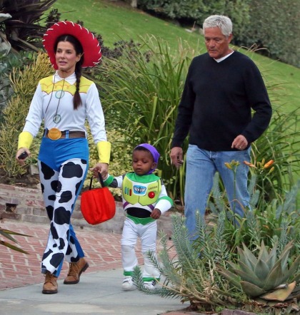 Sandra Bullock and Louis dress up as Toy Story characters for Halloween