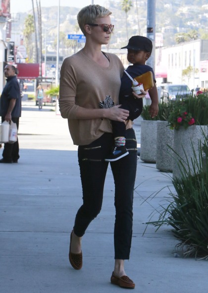 Charlize Theron's casual jeans & zebra sweater in   WeHo: gorgeous & simple'