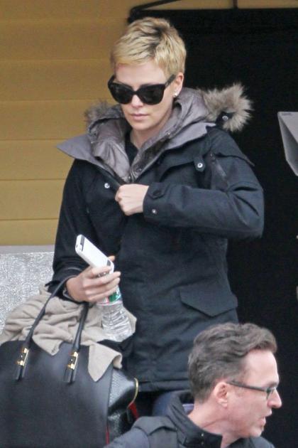 Charlize Theron Gets Busy on 