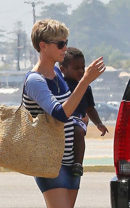 Charlize Takes a Family Flight for a Birthday Getaway