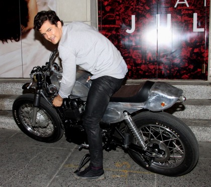 Orlando Bloom poses on a motorcycle for 'Romeo?, this does not bode well