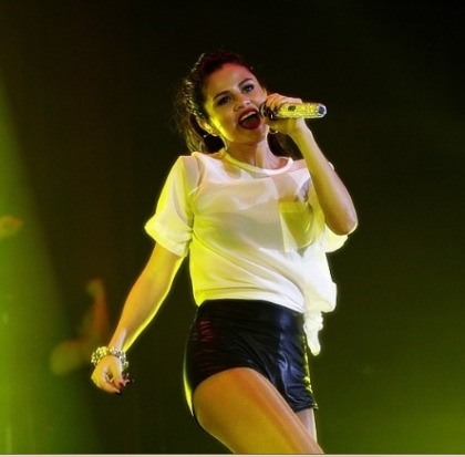 Selena Gomez Lovely Legs in Leather Shorts at Stars Dance Tour in Belgium
