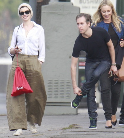 Anne Hathaway in wrinkled, linen-blend palazzo pants in LA: tragic or cute?