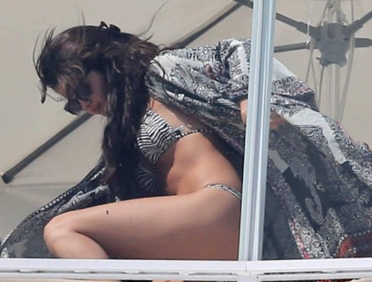 Selena Gomez On a Balcony in a Bikini