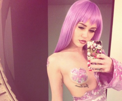 Miley Cyrus Dresses as Lil Kim for Halloween
