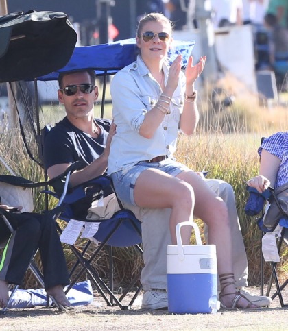 LeAnn Rimes poses on Eddie's knee during Mason's soccer game, of course