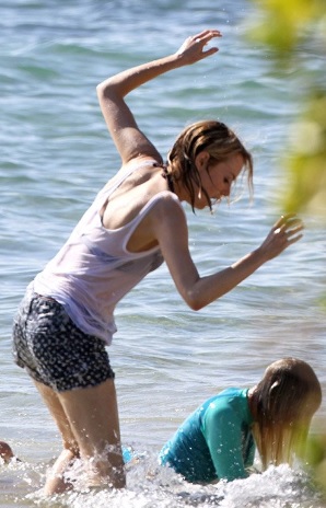 Emma Stone Sexy Wet T-shirt Paddleboarding in Hawaii