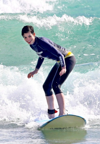Anne Hathaway Bikini Top and Wetsuit at a Beach in Hawaii