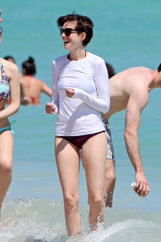 Anne Hathaway Covered Bikini on the Beach in Miami