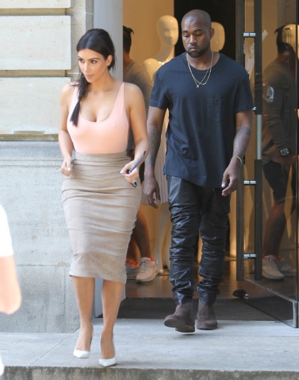 Kim Kardashian wore a weird swimsuit & a suede skirt in Paris: inappropriate or cute?