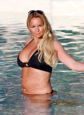 Jennifer Ellison Shows off Plenty of Cleavage in the pool Tenerife