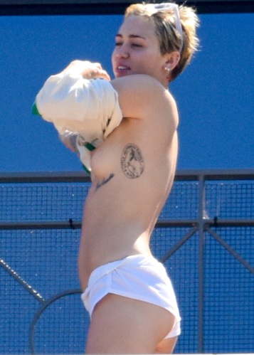 Miley Cyrus Sunbathes Topless On A Hotel Balcony In Sydney