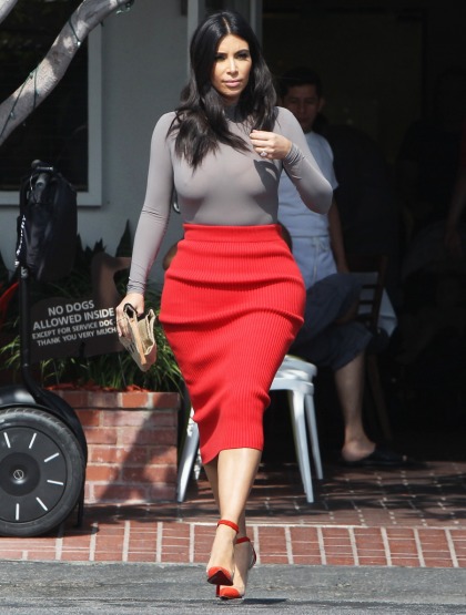 Kim Kardashian in a red ribbed skirt & grey bodysuit: unflattering or not bad?