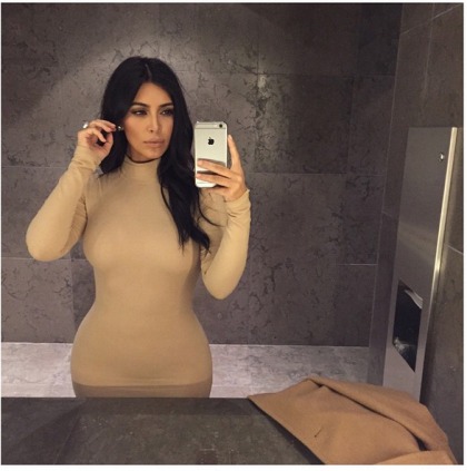 Kim Kardashian is crazy orange, posts #DateNight bathroom selfies, of course
