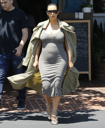 Kim Kardashian's bulky July coats explained: she's a butt-covering ninja